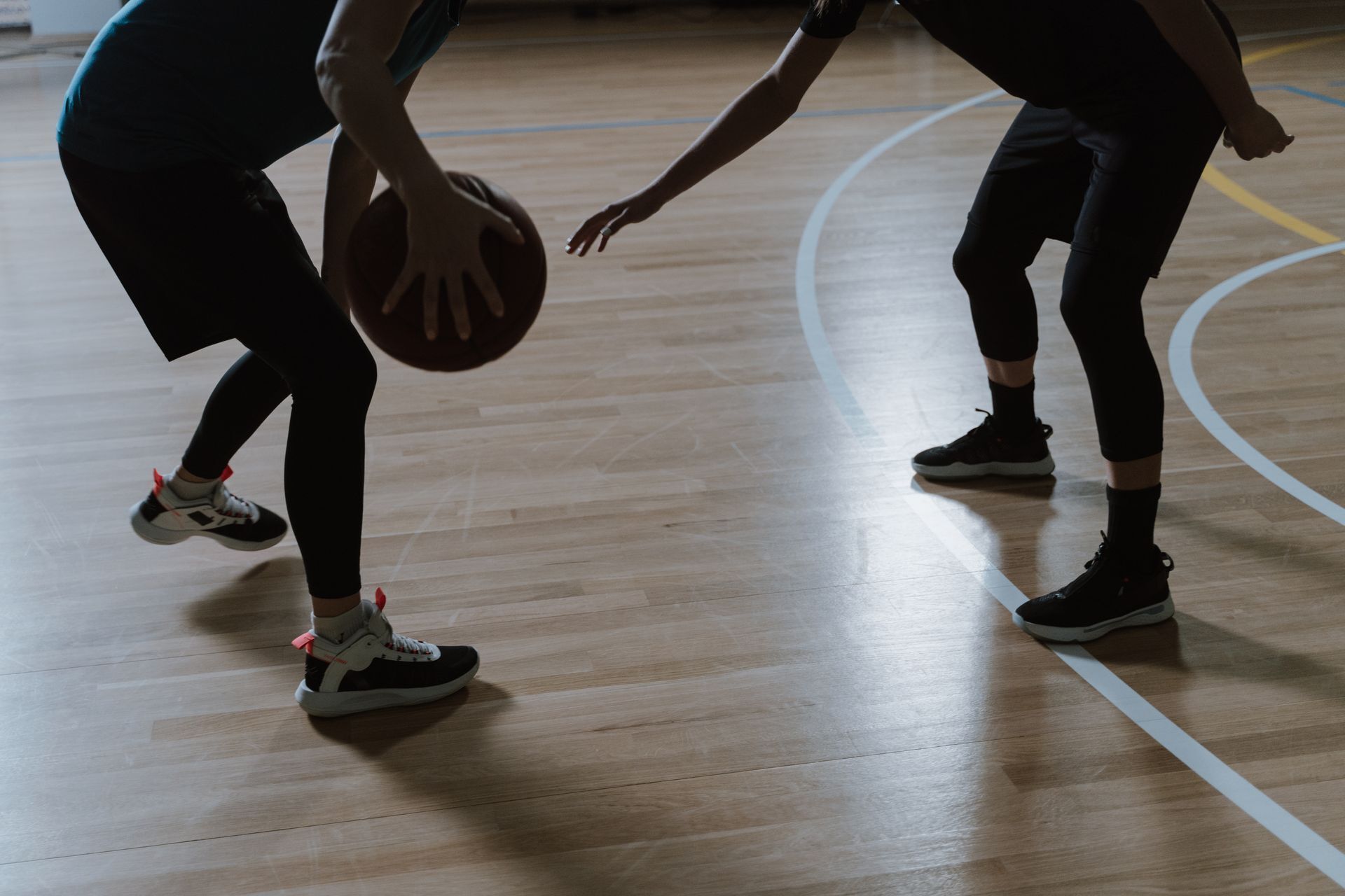 Basketball players training indoors